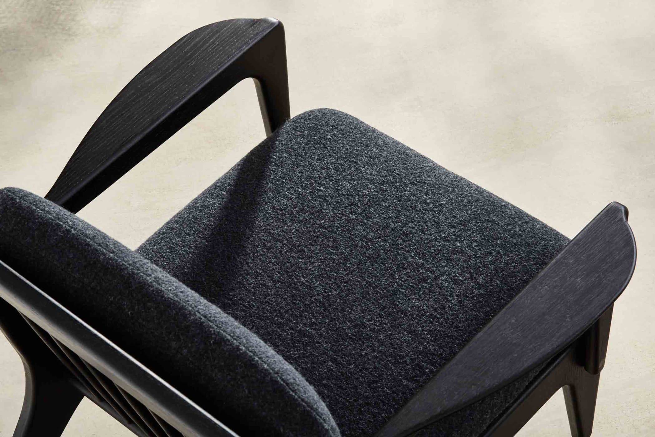 ebonised armchair with black wool upholstery