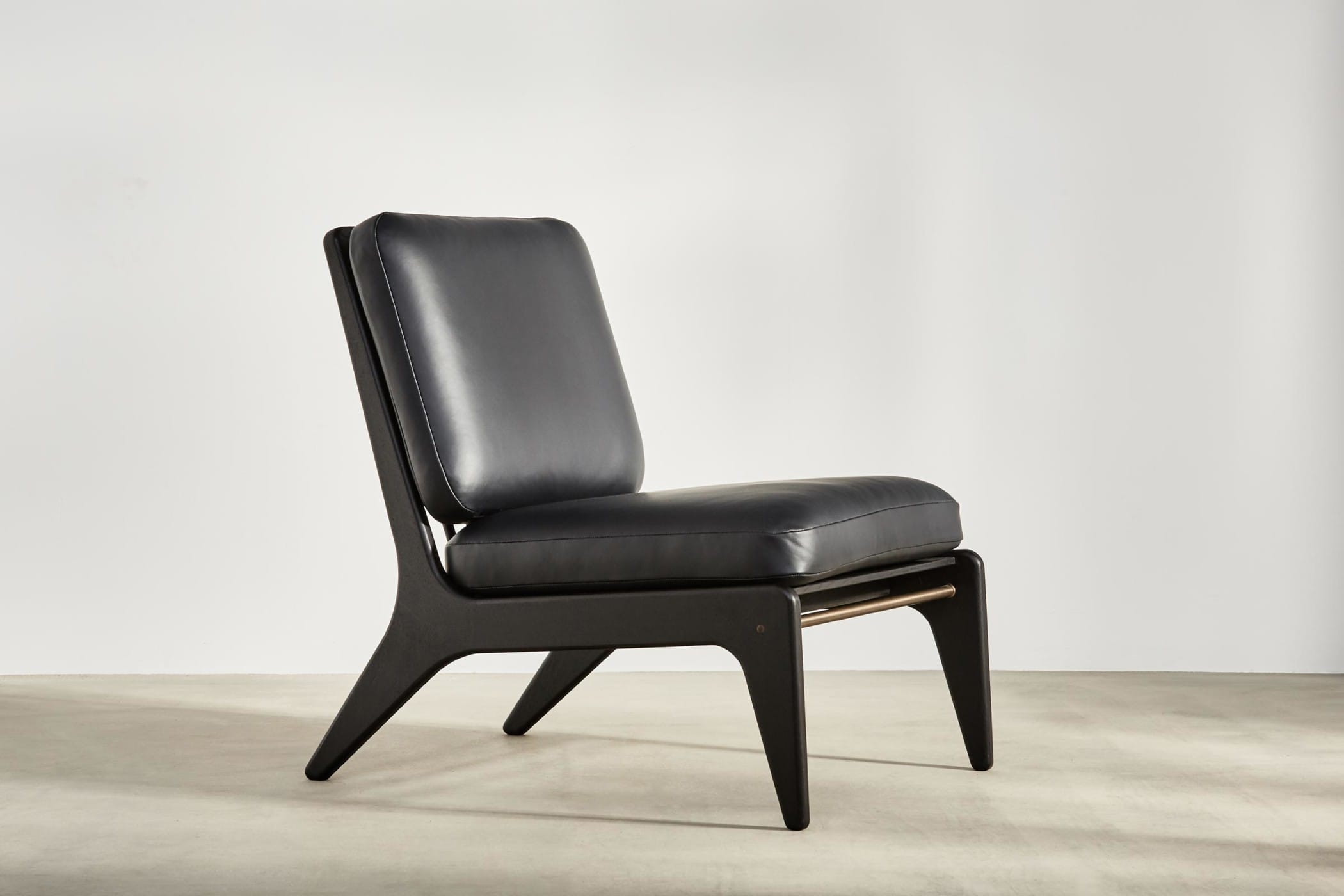black medium chair with black leather upholstery