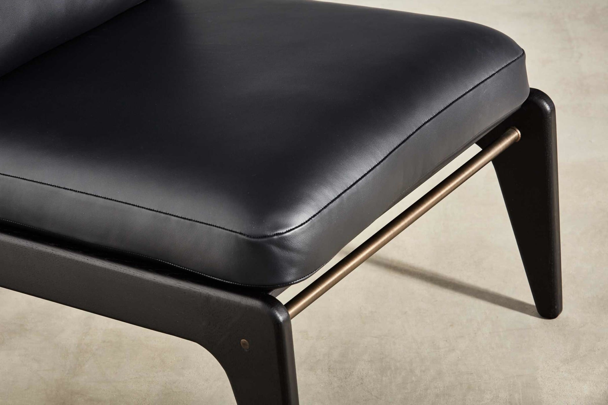 black medium chair with black leather upholstery