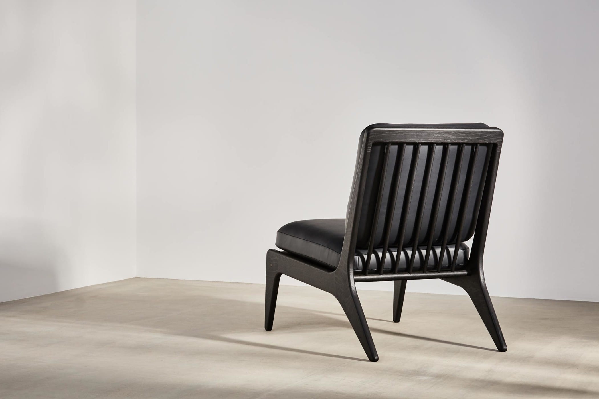 black medium chair with black leather upholstery