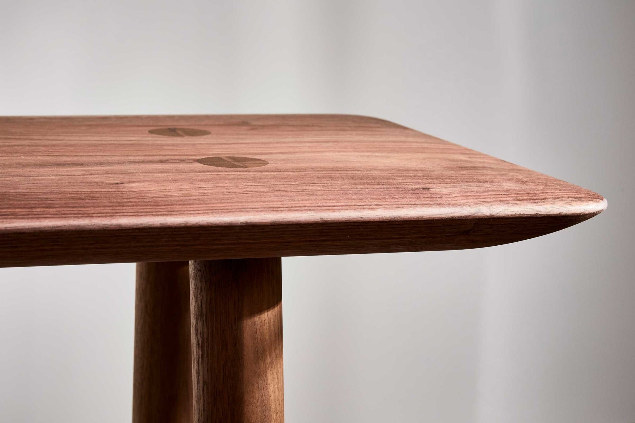 modern looking short walnut bench