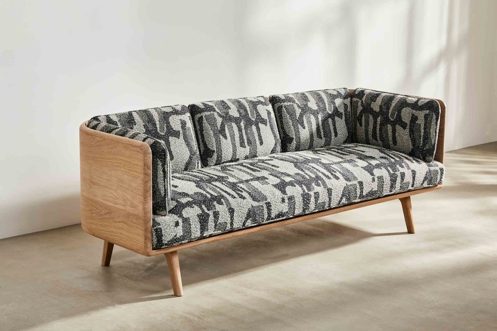 oak sofa with black and white fabic
