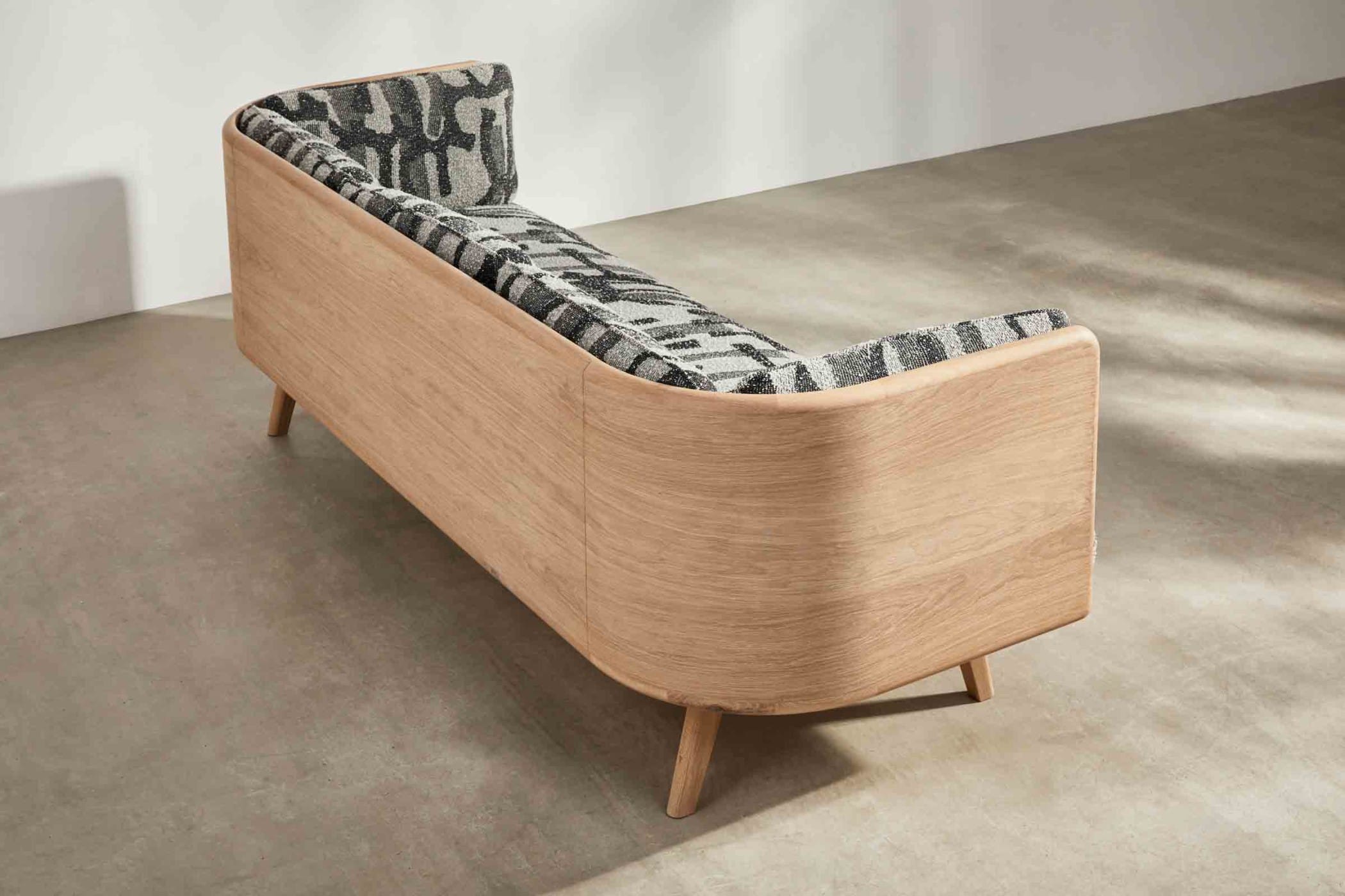 oak sofa with black and white fabic