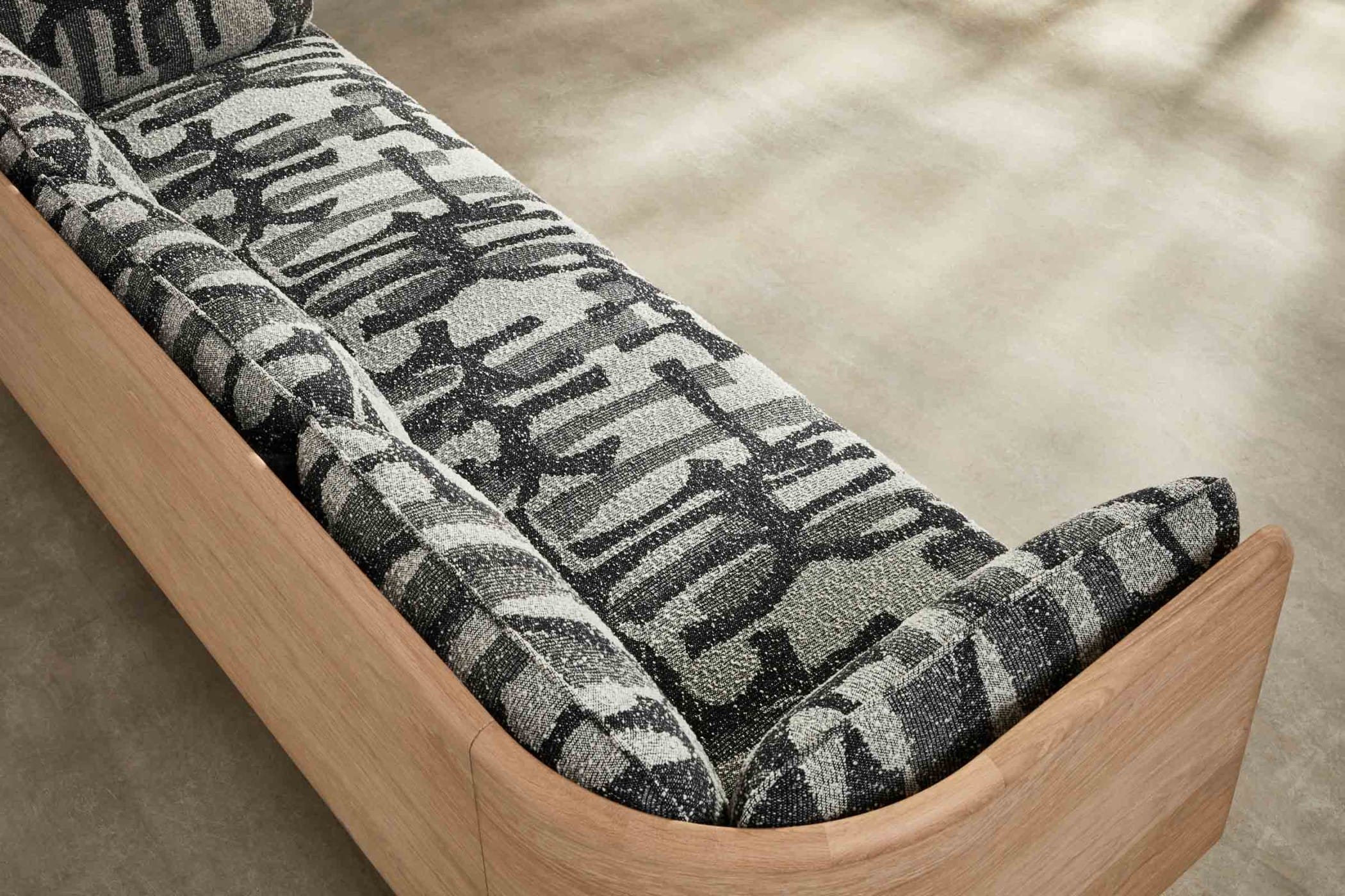 oak sofa with black and white fabic