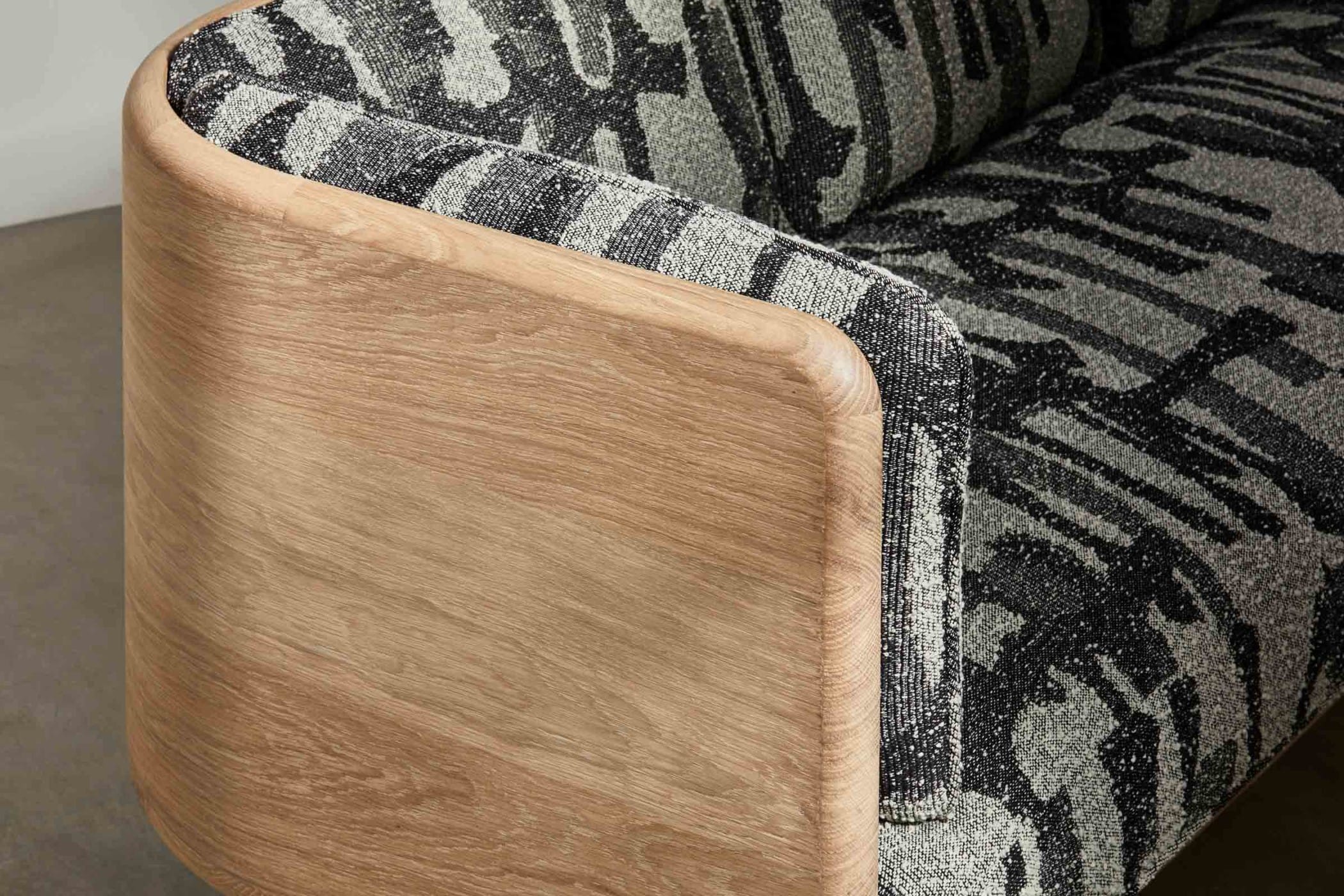 oak sofa with black and white fabic