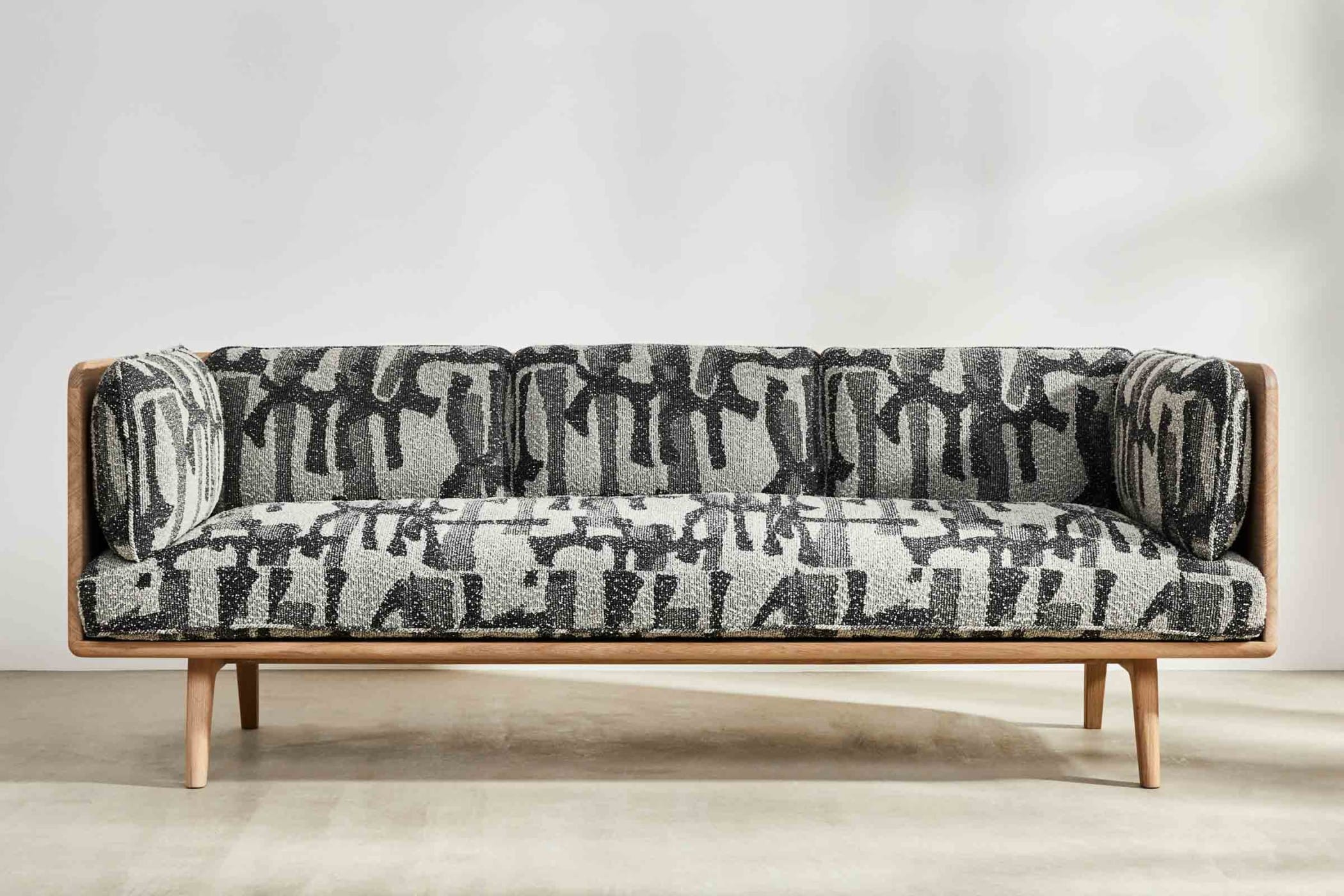 oak sofa with black and white fabic