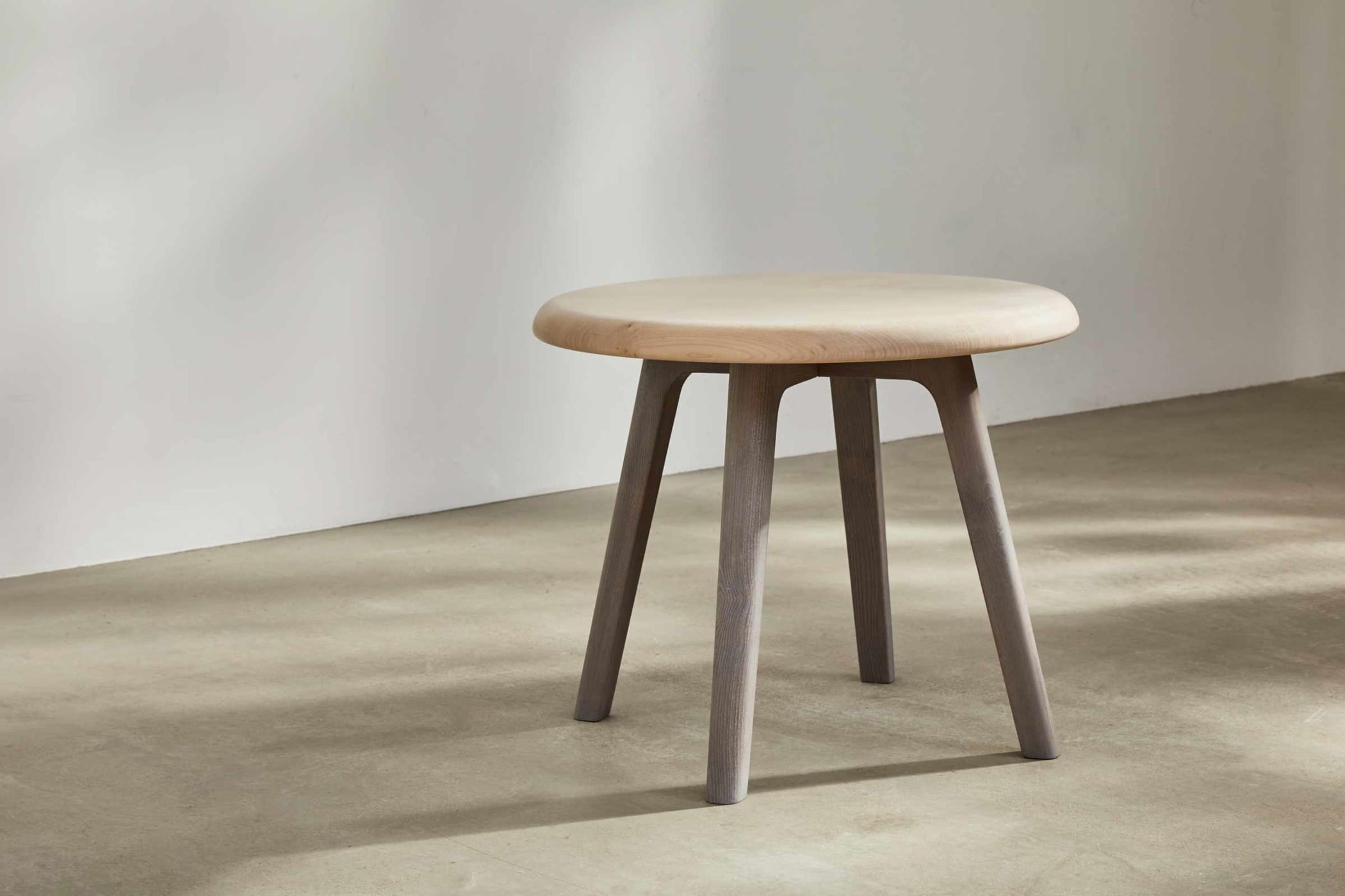 circular side table with a sycamore top and an ash underframe