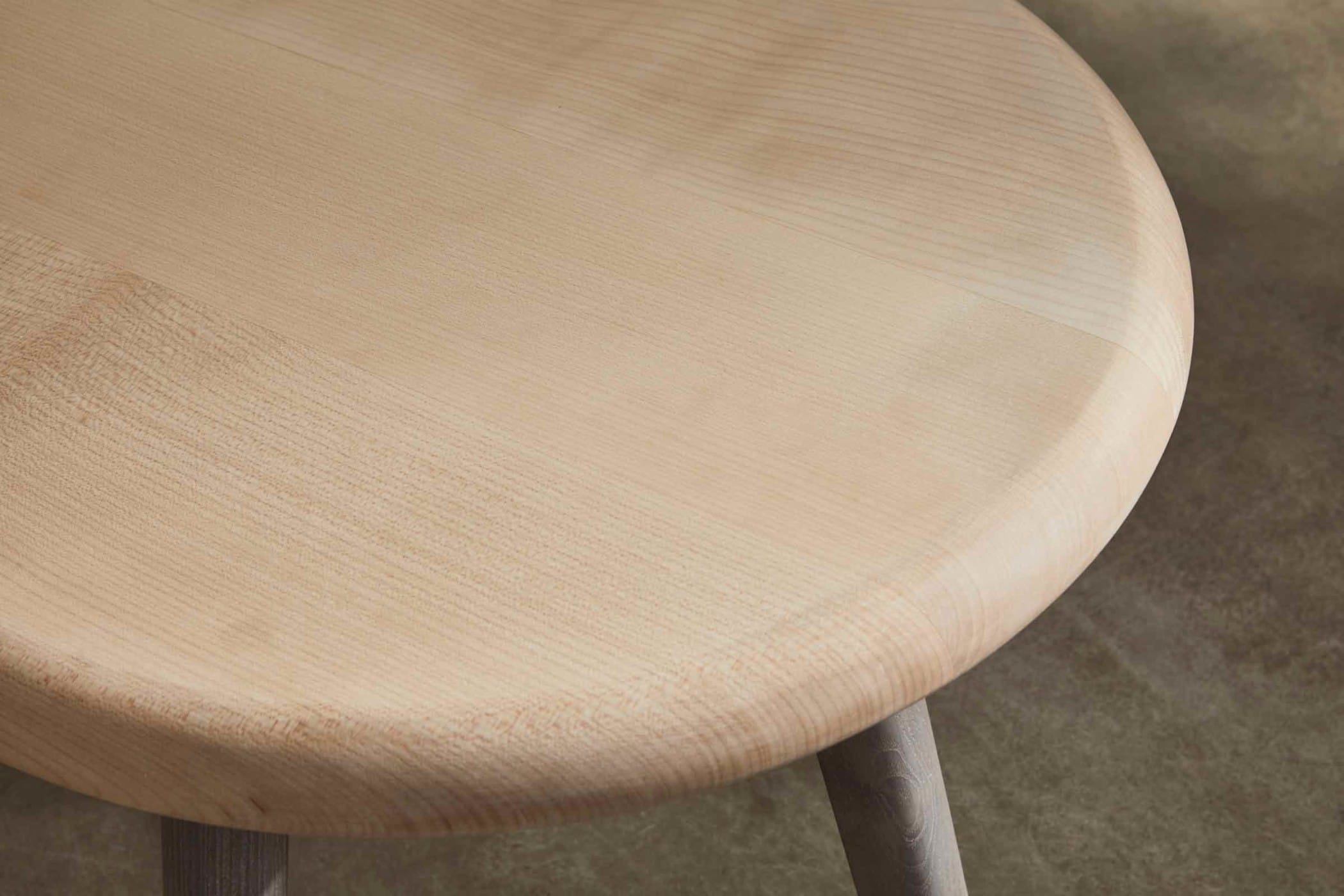 circular side table with a sycamore top and an ash underframe