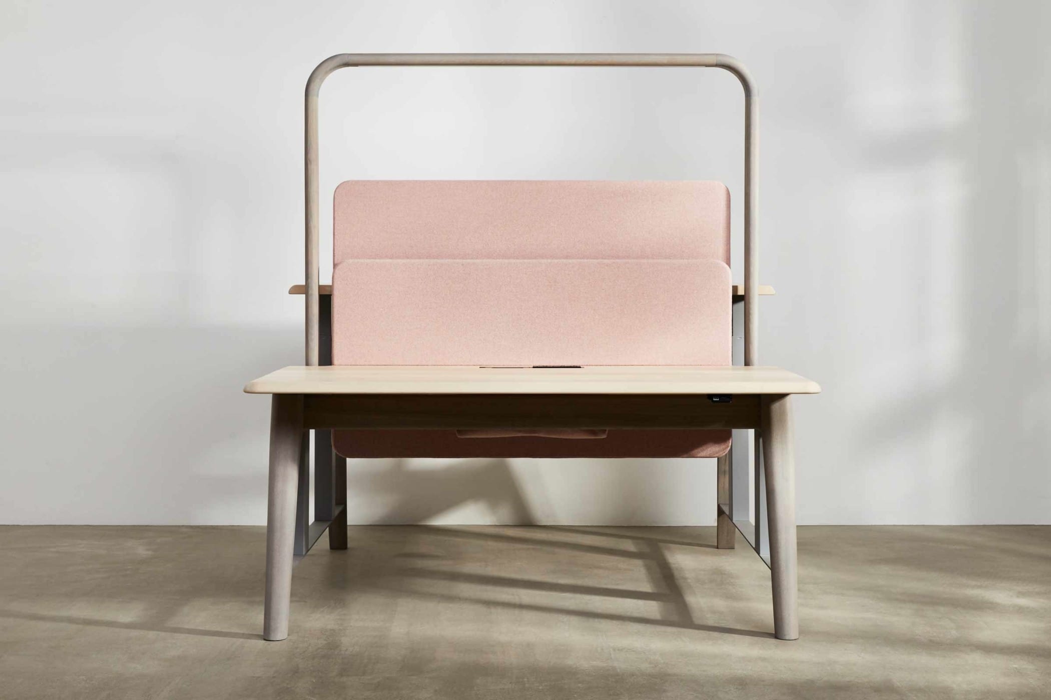 sit-stand workbench made from sycamore and ash with a light pink felt board