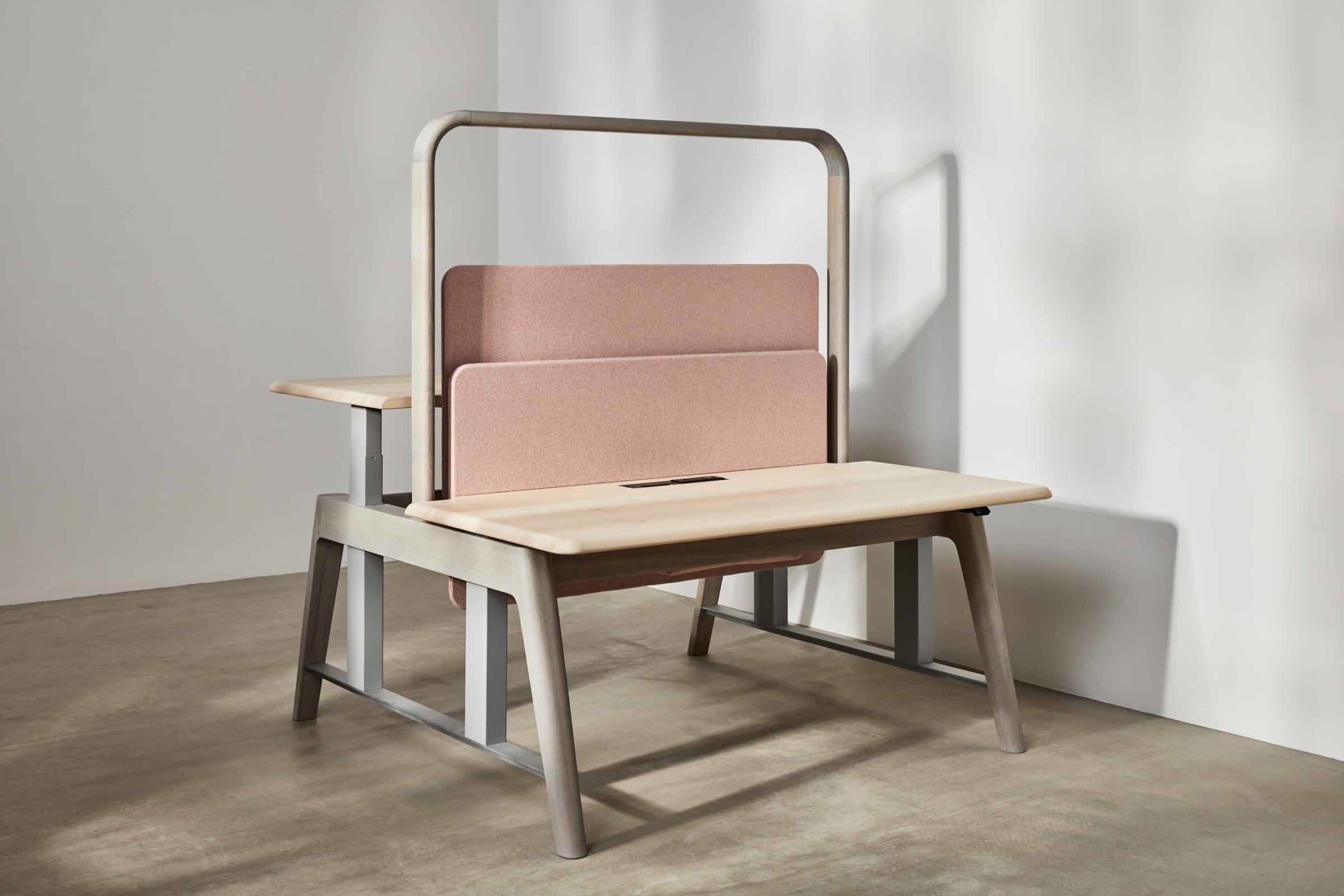 sit-stand workbench made from sycamore and ash with a light pink felt board