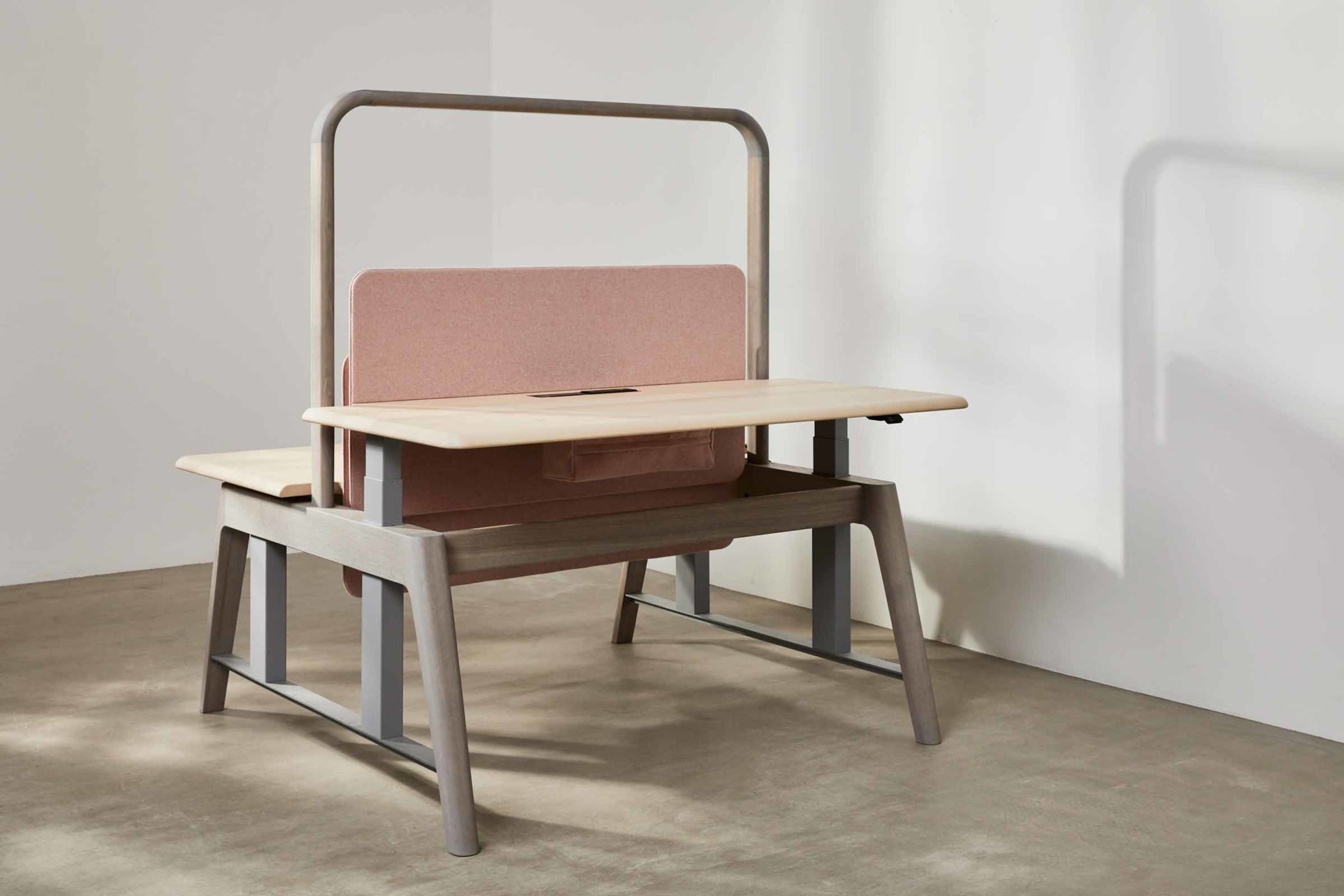 sit-stand workbench made from sycamore and ash with a light pink felt board